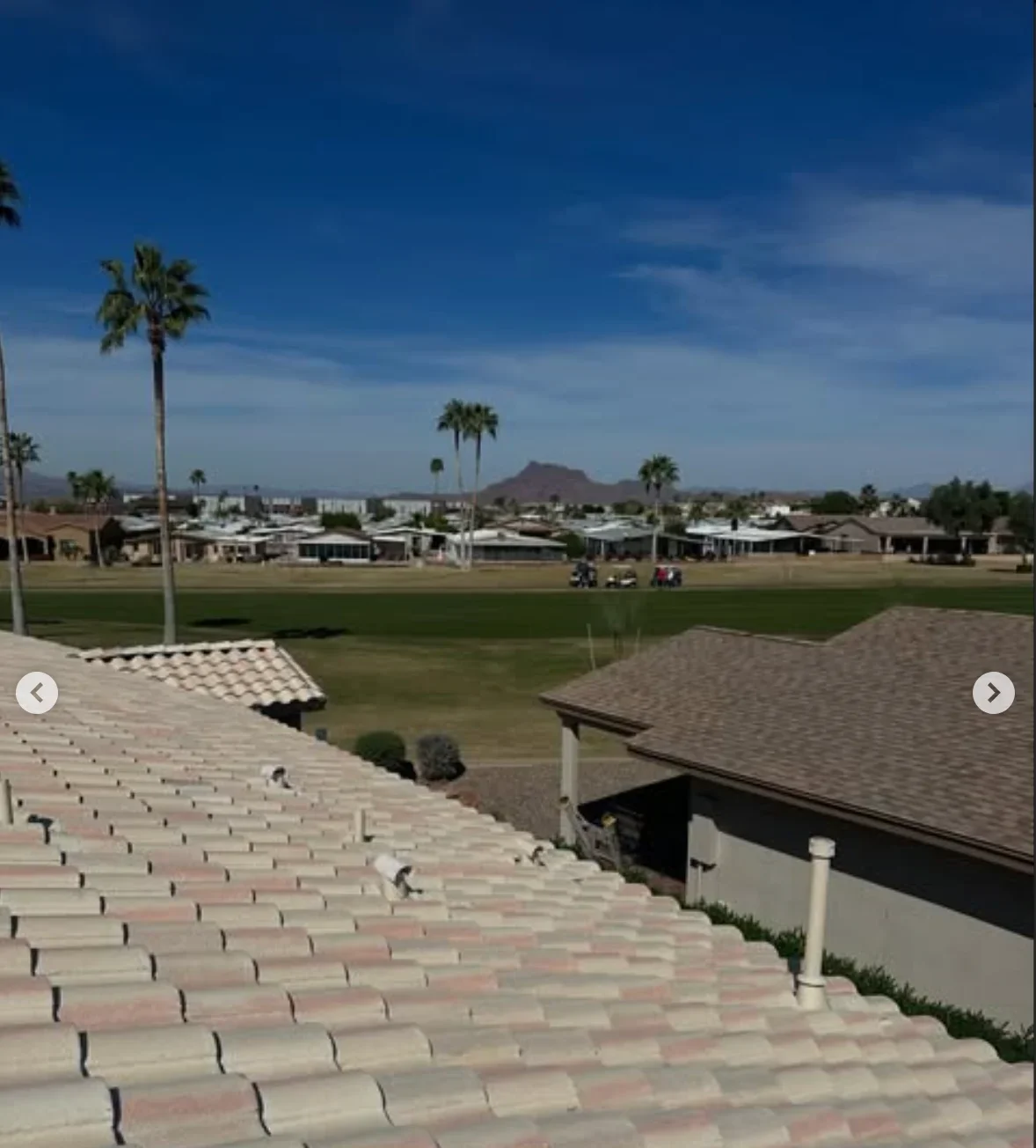 Clay barrel tile roof installation on residential homes overlooking golf course with proper fastening and spacing