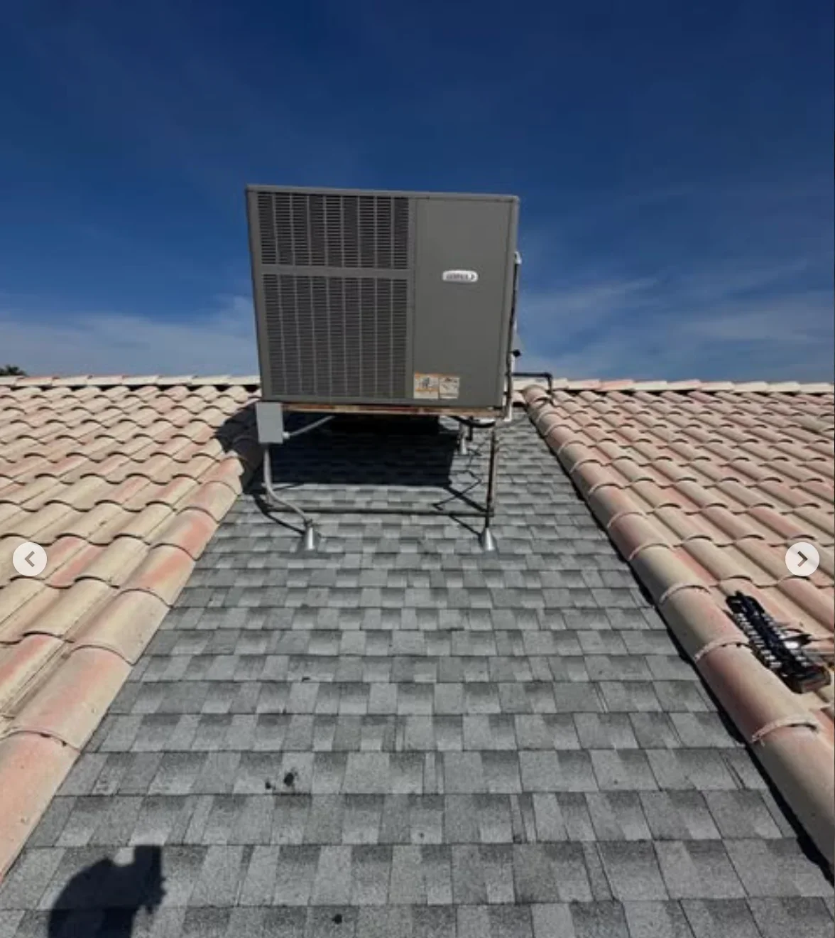 HVAC unit mounted on tile and shingle roof with copper ductwork and proper flashing